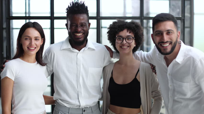 Smiling professional business leaders and employees group team portrait