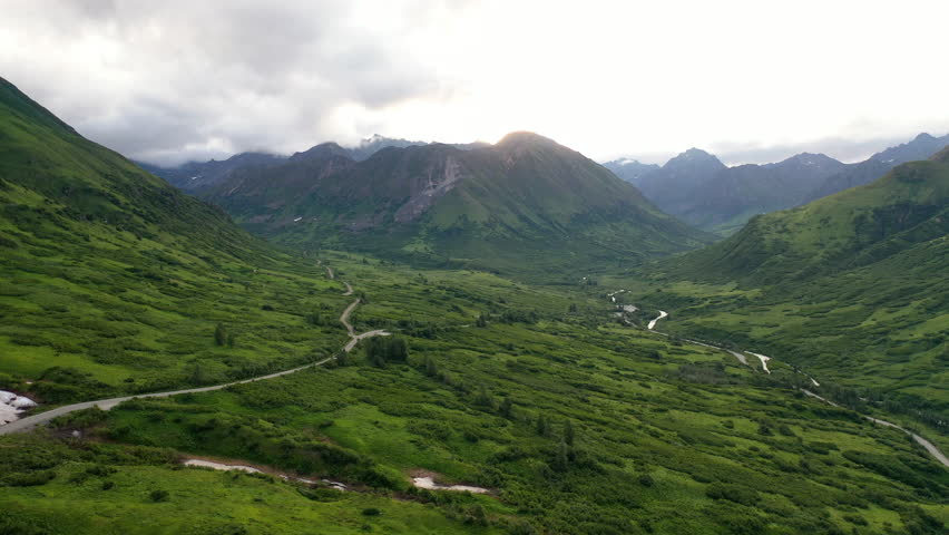 Aerial view of Hatcher Pass, Alaska. Mountain pass through the Talkeetna Mountains from above. Summer Alaskan landscape 