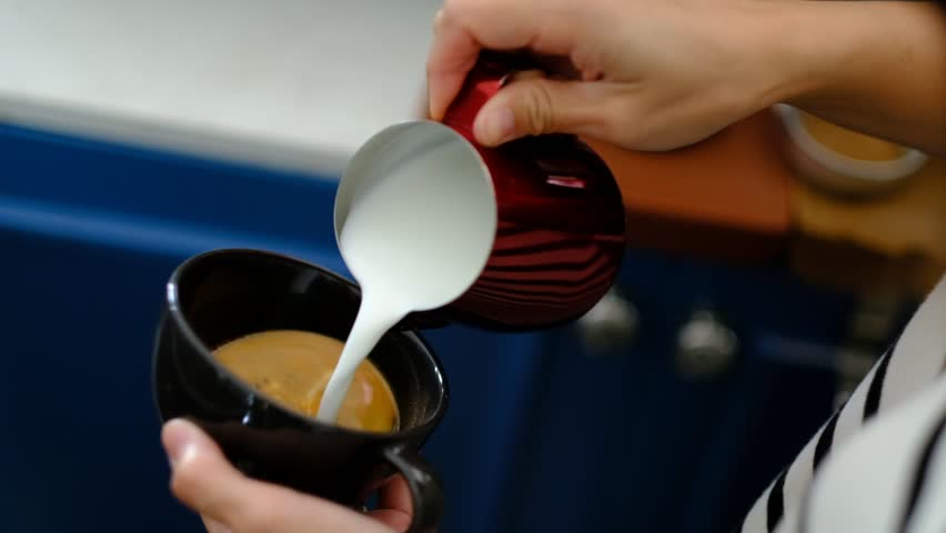 Closeup hand doing hot latte art coffee
 | Shutterstock HD Video #1098297983