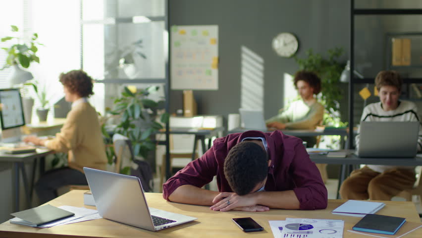 Time lapse of exhausted businessman sleeping at desk during workday in office | Shutterstock HD Video #1098300099
