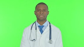 Young African Doctor Talking on Online Video Chatl on Green Background