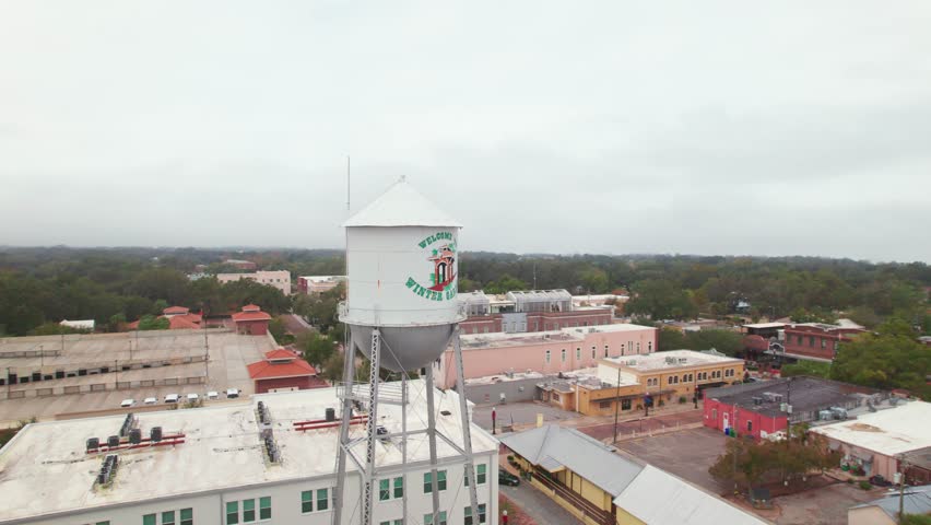 Aerial view of the charming water tower and buildings of Downtown Winter Garden. Winter Garden is a family oriented biking town where residents ride in golf carts to shopping, restaurants, and bars.