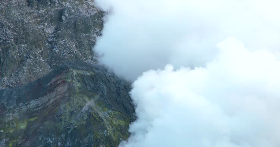White smoke plume rising from geothermal volcanic fumerole, Whakaari