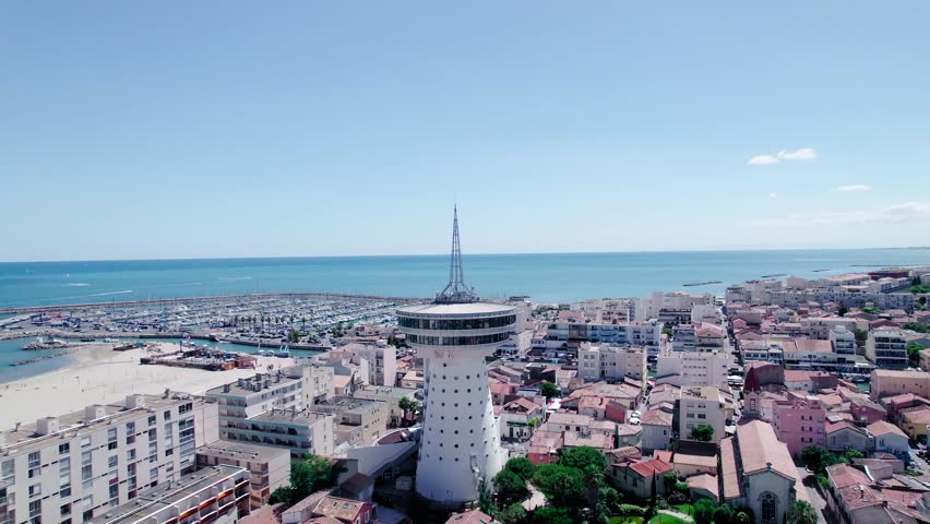 Ascending tilting shot of theMediterranean Lighthouse in Palavas, Montpellier