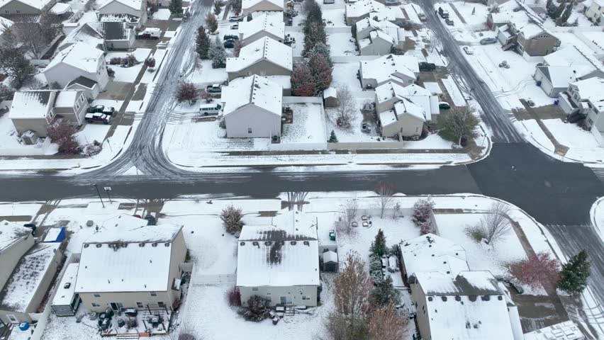 Overhead aerial view of a Spokane suburban neighborhood covered in a blanket of fresh snow.