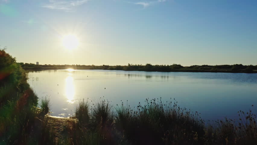 sunset over a lake near Valras-plage aerial shot France
