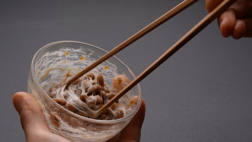 Video of checking the stickiness of NATTO on a dabble. Royalty-Free Stock Footage #1098329441