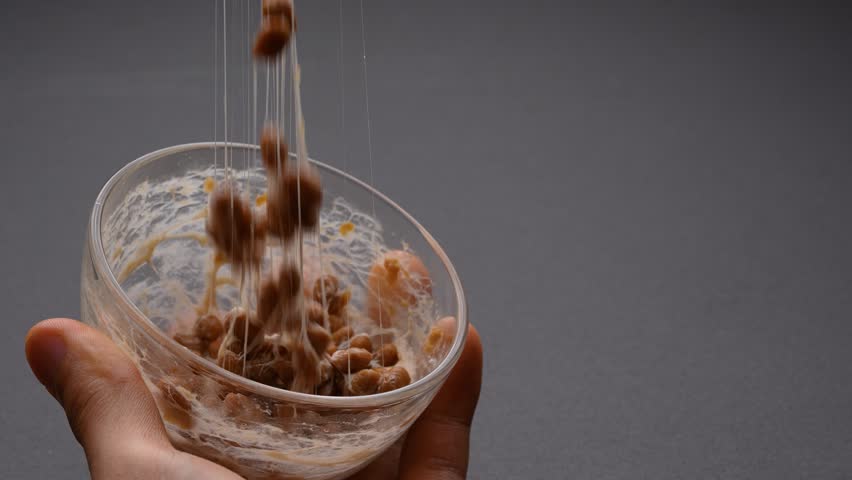 Video of checking the stickiness of NATTO on a dabble. | Shutterstock HD Video #1098329441