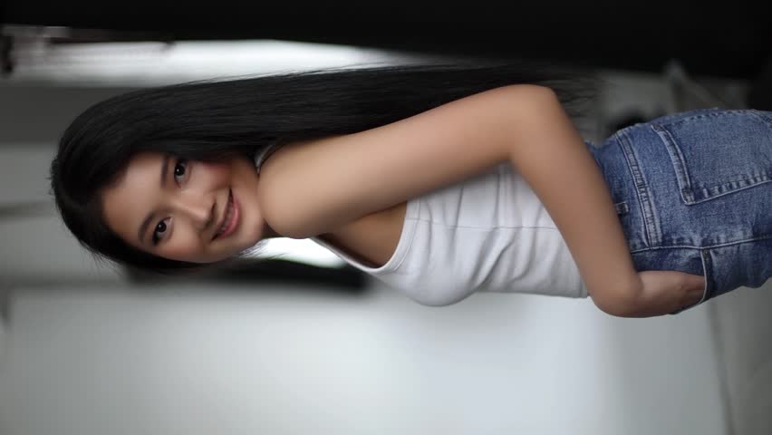 Beautiful Asian Girl Model Posing in Front of the Camera Showing Different Emotions