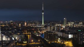 Establishing Aerial View Shot of Berlin, Germany, capital of Germany, at evening night, city center view, low busy, circling right