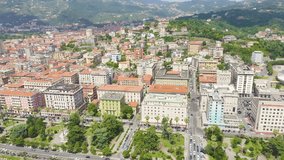 Inscription on video. La Spezia, Italy. Flight along the coast, Viale Italia street. View from above. Text from small balls, Aerial View