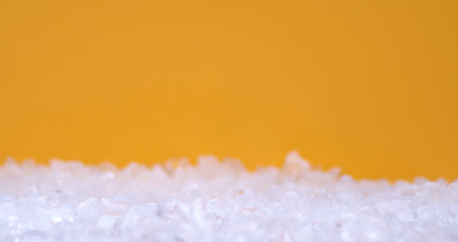 Slow motion of ice cubs filling in sliced pears, fresh fruits for juicy, cold, white food for summer time. Filmed on high speed cinema camera, 8K downscale, 4K.