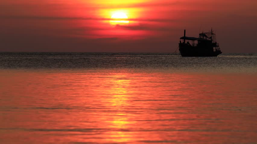 Spectacular sunset with boats in the sea, Koh Tao, Thailand