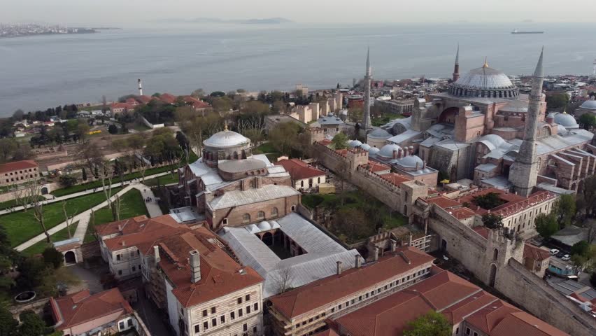 Drone shot of Hagia Irene and Hagia Sophia in Istanbul, Turkey - drone is circling around. Snippet could ideally be used for travel or Istanbul related movies and Europe, Asia or Turkey videos.