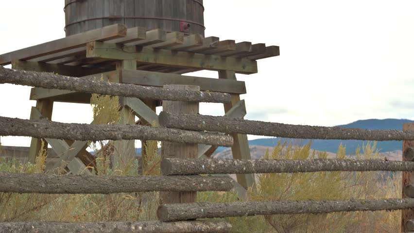 Pan Up shot of an old water tower in a desert environment called Deadman Junction on Highway 1 in British Columbia Canada