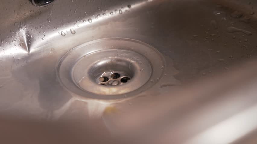 Soapy water flows down the sink drain | Shutterstock HD Video #1098353055