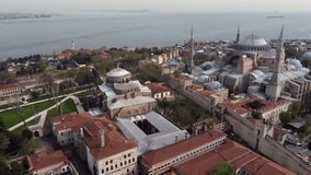 Drone shot of Hagia Sophia and the Blue Mosque in Istanbul - drone is showing the garden of Topkapı. Snippet could ideally be used for travel or Istanbul related movies and Europe or Turkey videos.