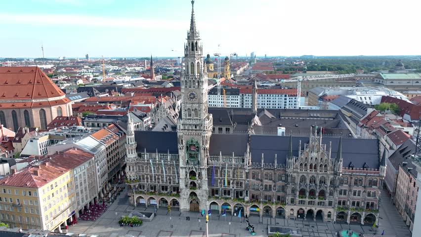 Aerial view on the historical town hall, symbol of the city, on the main square Marienplatz in the center of the city in Munich, Germany, real time Royalty-Free Stock Footage #1098360843