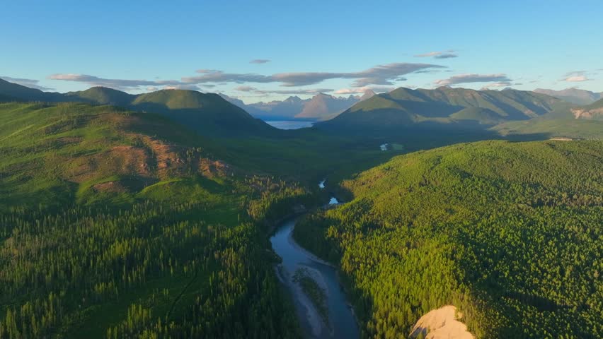 Panorama Of Flathead River With Greenery Forest Mountains Near Glacier National Park In Montana, USA. Aerial Shot
