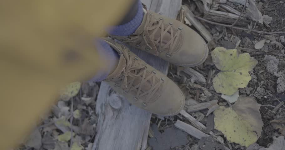 Scene with boots viewed from above with rotating motion frame in slow motion  4K F-LOG2 video format