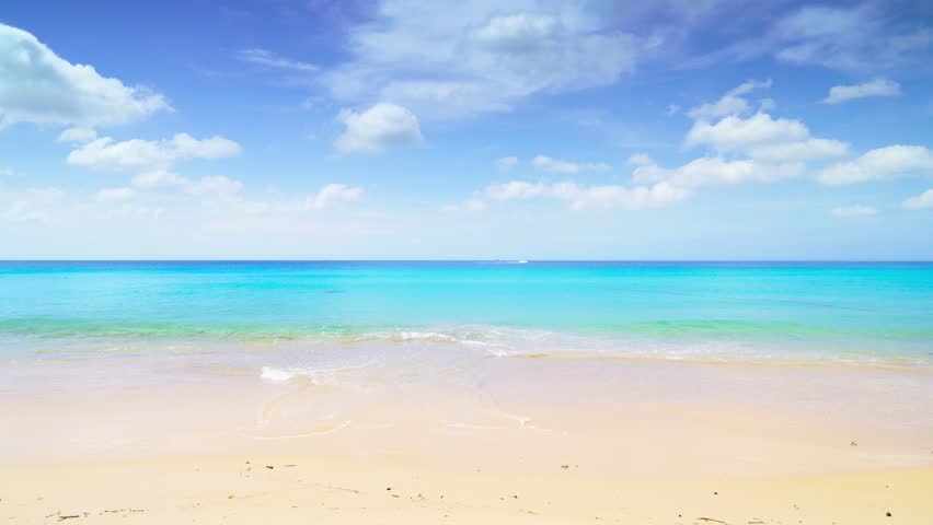 Natural view of peaceful beach and sea on sunny day at the beach.