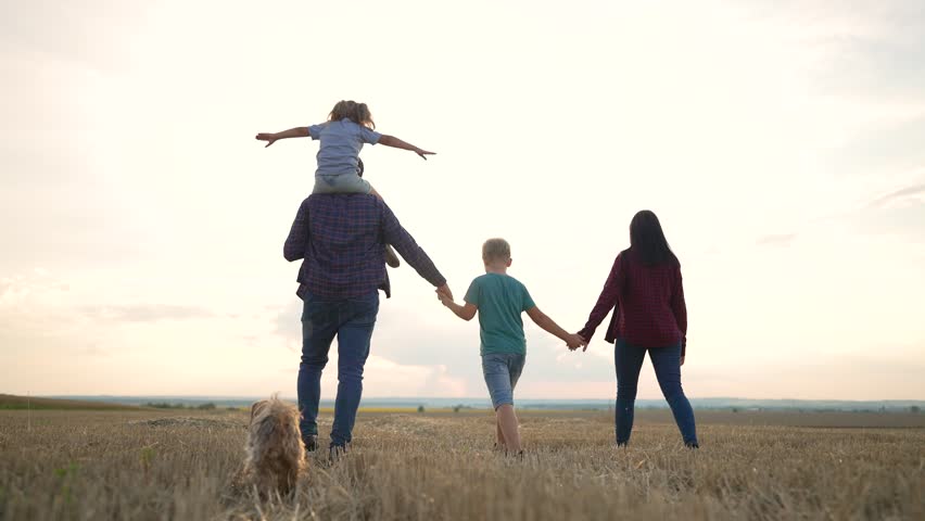 Happy active lifestyle. Family walk in summer park. Happy family parents, children walk together along the meadow of the park.Happy family children. Summer travel go everywhere. Royalty-Free Stock Footage #1098379293