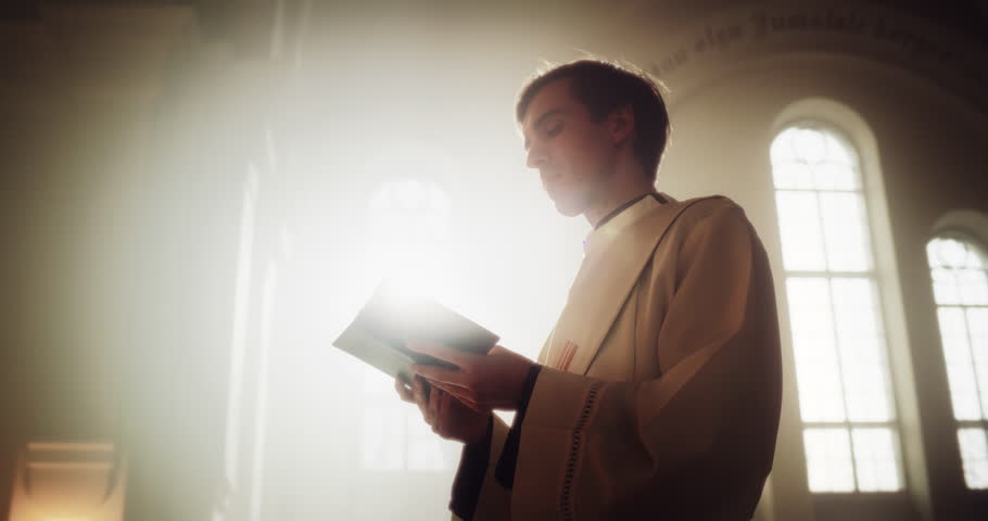 In Christian Church: Portrait of Minister Leading Congregation In Prayer, Reads From The Holy Book, The Bible, Gospel of Jesus. Priest Providing Guidance, Belief, Hope to People. Cinematic Warm Light Royalty-Free Stock Footage #1098380905