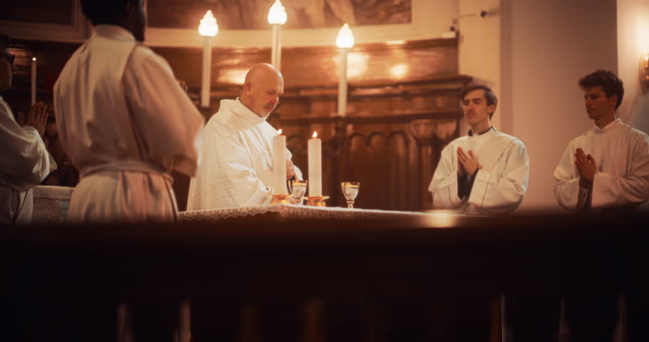 The Eucharist Service In Grand Church: Ministers of Christian Faith lead The Ceremony that Involves Sharing Bread in Honor of Jesus Christ. Holy Communion, Divine Mass, Lord
