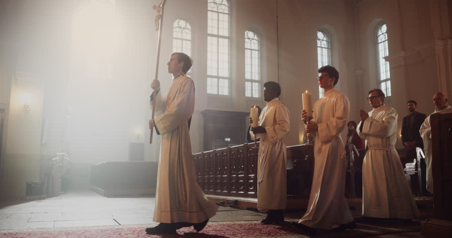Liturgical in Grand Church: Majestic Procession Of Ministers And Priests Walking with Processional Cross. Congregation Stands In Reverence, Christians Rejoice In Ceremony of Mass in The Lord's Glory | Shutterstock HD Video #1098380989