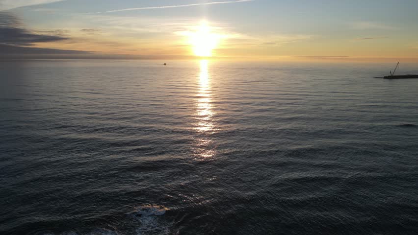 Stunning sunset on the horizon, view from Foz do Douro, Porto, Portugal, 4k