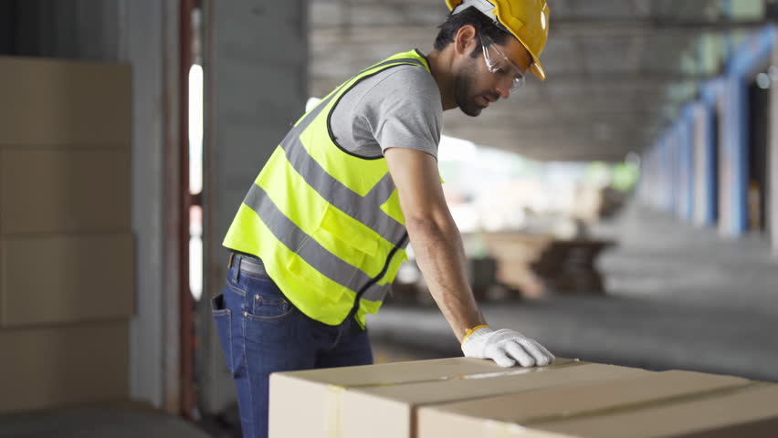 Portrait of middle east worker working in large warehouse store industry.Rack of stock storage. Interior of cargo in logistic concept. Depot. People lifestyle. Shipment service for container | Shutterstock HD Video #1098391431