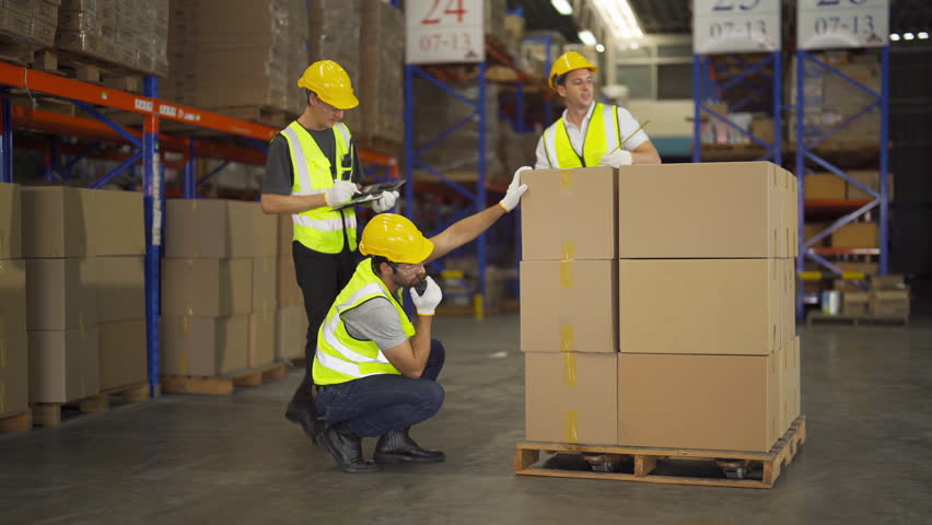 Teamwork of workers working in large warehouse retail store industry.Rack of stock storage. Interior of cargo in ecommerce and logistic concept. Depot. People lifestyle. Shipment service for container | Shutterstock HD Video #1098391533