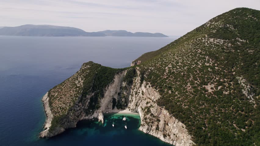 Yachting. Luxury Sail boat . Aerial top down view of rich yacht sailing sea. Summer journey on luxury ship. Summer luxury modern boat trip. View from above of white boat on deep blue water.