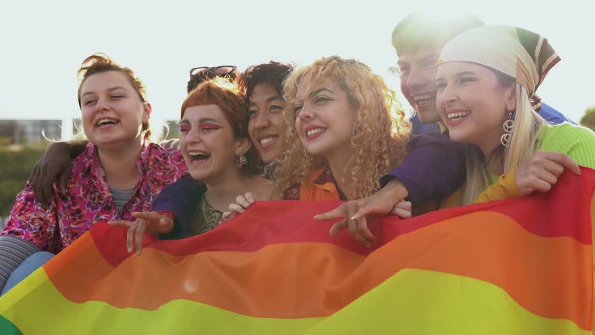 Group of happy young people having fun together during LGBT pride parade | Shutterstock HD Video #1098401543