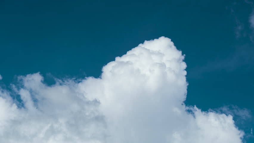Timelapse of white puffy cumulus clouds forming on summer blue sky. Moving and changing cloudscape weather | Shutterstock HD Video #1098403901