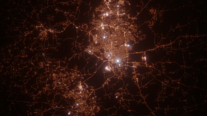 Montgomery (Alabama, USA) top view at night. View on modern city from satellite. Camera is zooming in, rotating counterclockwise. Vertical video. The north is on the left side