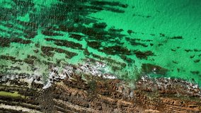 Aerial top view 4k footage by drone of ocean green waves. South Australia. Carrickalinga Beach