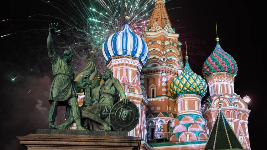Celebratory colorful fireworks and Cathedral of Intercession of Most Holy Theotokos on the Moat ( Temple of Basil the Blessed),  Red Square, Moscow, Russia (time lapse, with zoom)