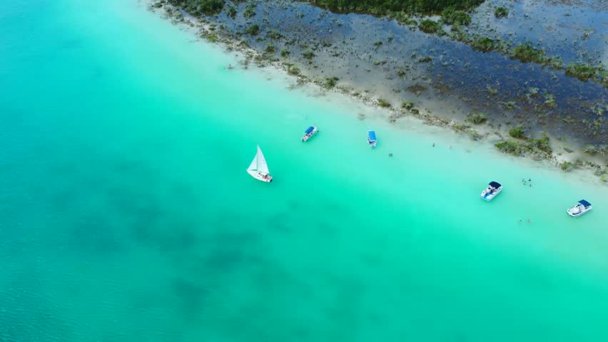 Aerial view of the sailing boat on the lake Bacalar, Mexico Royalty-Free Stock Footage #1098415769