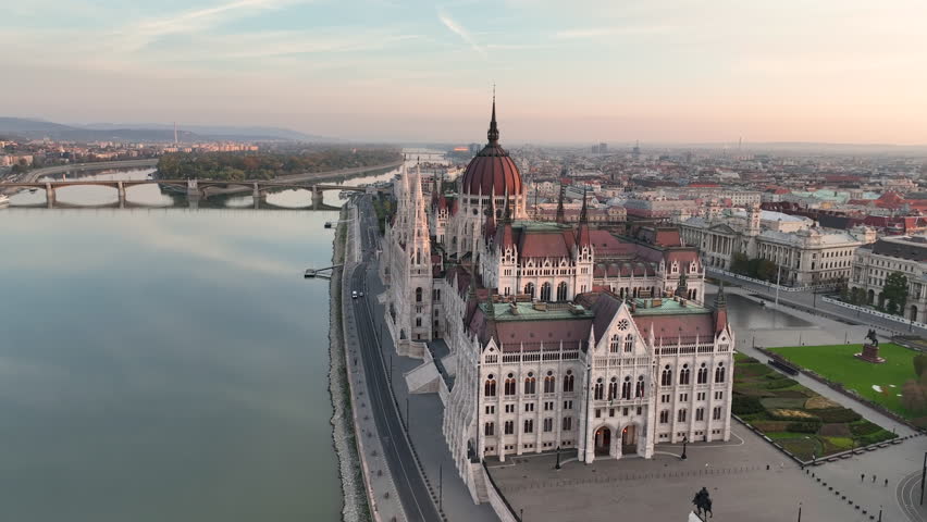 Aerial view of Hungarian Parliament Building at sunrise with the Danube river, in Budapest, Hungary. Travel, tourism and European Political Landmark Destination 