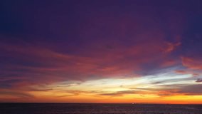 aerial view colorful sky at sunrset above the ocean.
abstract nature background. 
Sunset with sweet color light rays and other atmospheric effects.
4k video colorful sky background.
