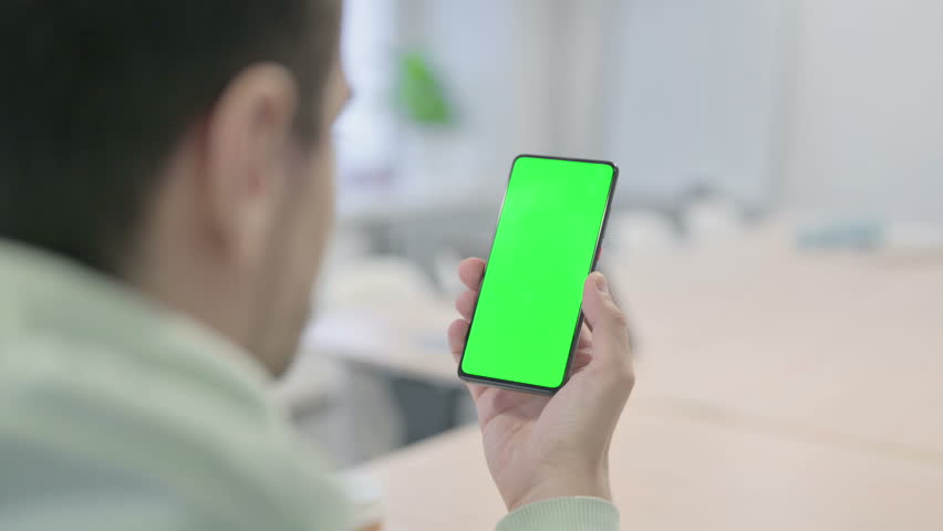 Young Adult Man Using Smartphone with Chroma Key