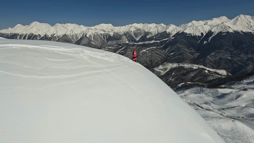 Sportsman skier extreme sport freeride downhill drop mountain summit adrenaline race snow splash aerial view. FPV drone shot male ski professional athlete rider cliff valley sunny landscape 4k 120fps | Shutterstock HD Video #1098422029