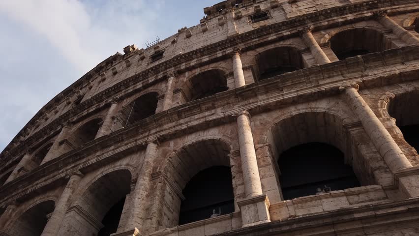 DOLLY SHOT - Superposed order of the Colosseum in Rome, Italy. The ancient Roman Colosseum is one of the main tourist attractions in Europe.