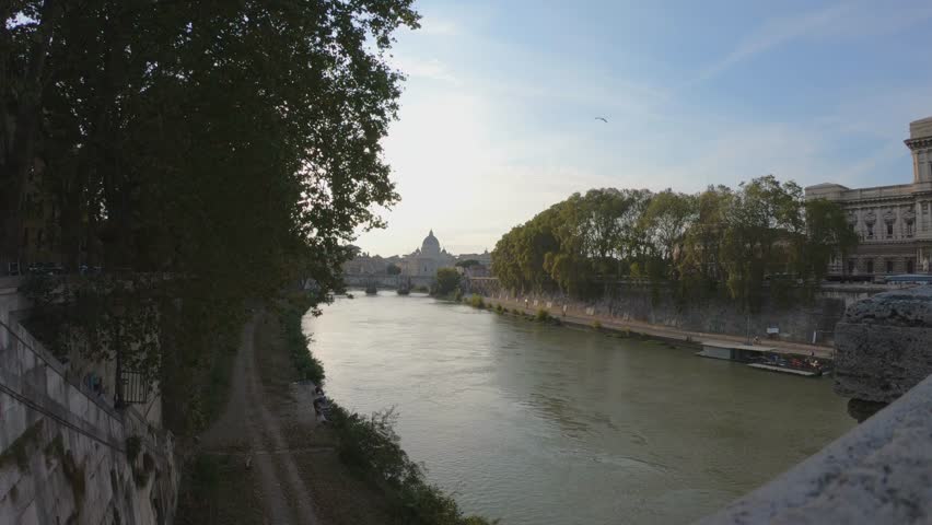 View of Tiber River, bridge Vittorio Emanuele II and Saint Peter Cathedral, Rome, Italy.