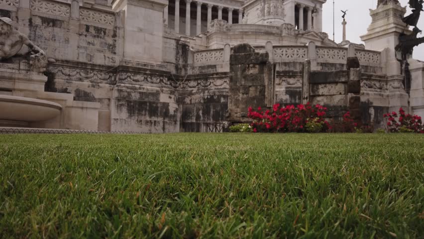 TILT SHOT - National monument to Vittorio Emanuele II (Victor Emmanuel II) in Rome, Italy. The Sepolcro di Caio Publicio Bibulo and the Fontana dell