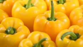 Yellow pepper close up, rotating background. Vegan vegetable sweet organic bell peppers backdrop. Fresh sweet organic bell pepper close up.  - Powered by Shutterstock - Get 15% off with code: PIKWIZARD15