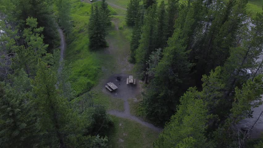 Picnic tables benches in park empty squirrels running approached Alberta Canada