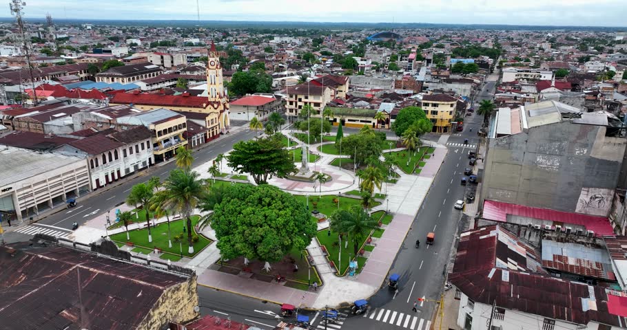 Aerial drone fly view of main square Iquitos, Peru. The Iglesia Matriz in the Plaza de Armas. St. John the Baptist Cathedral called Iquitos Cathedral is the main Catholic church in neo-Gothic style Royalty-Free Stock Footage #1098437635