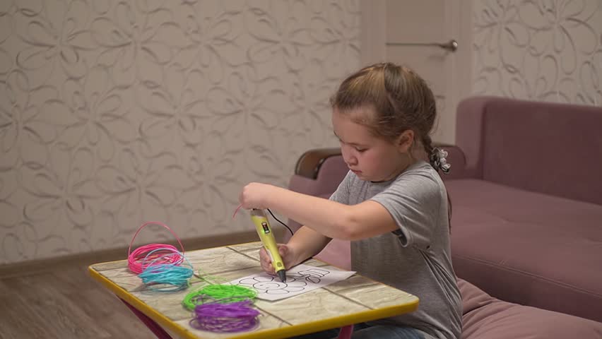the child uses a 3D pen, but it does not work, the girl is nervous. High-quality Full HD video recording. slow motion video
